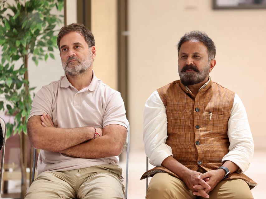 Two members of the panel listen during the graduation interaction