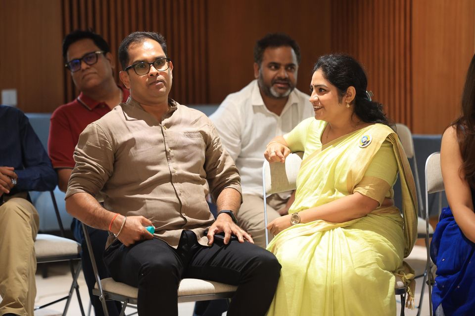 Fellows share a light moment at the graduation